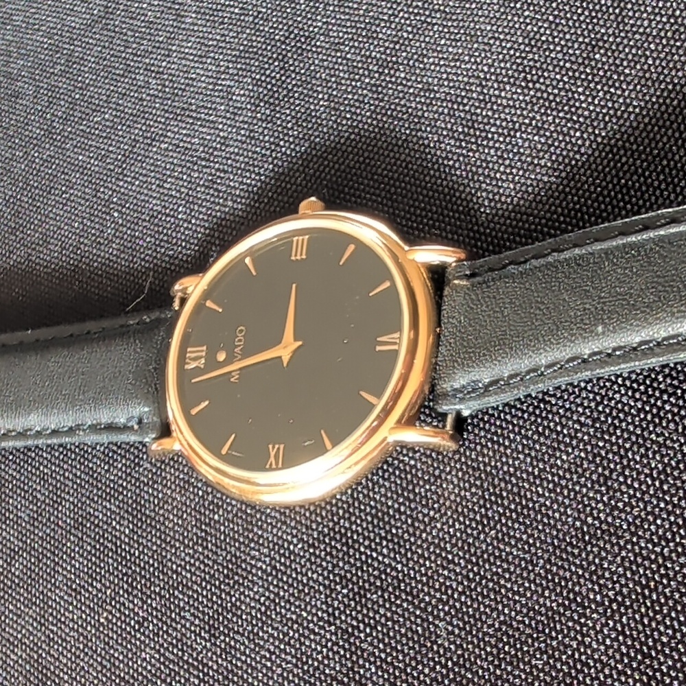 Movado Gold Case with Black Strap Watch